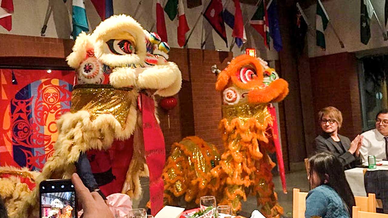 Lion dance being performed in the St. John's College Dining Hall