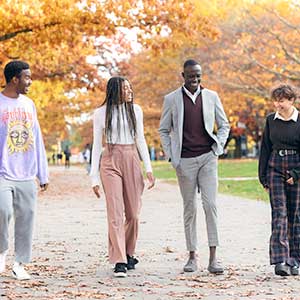 Four black students walking together.