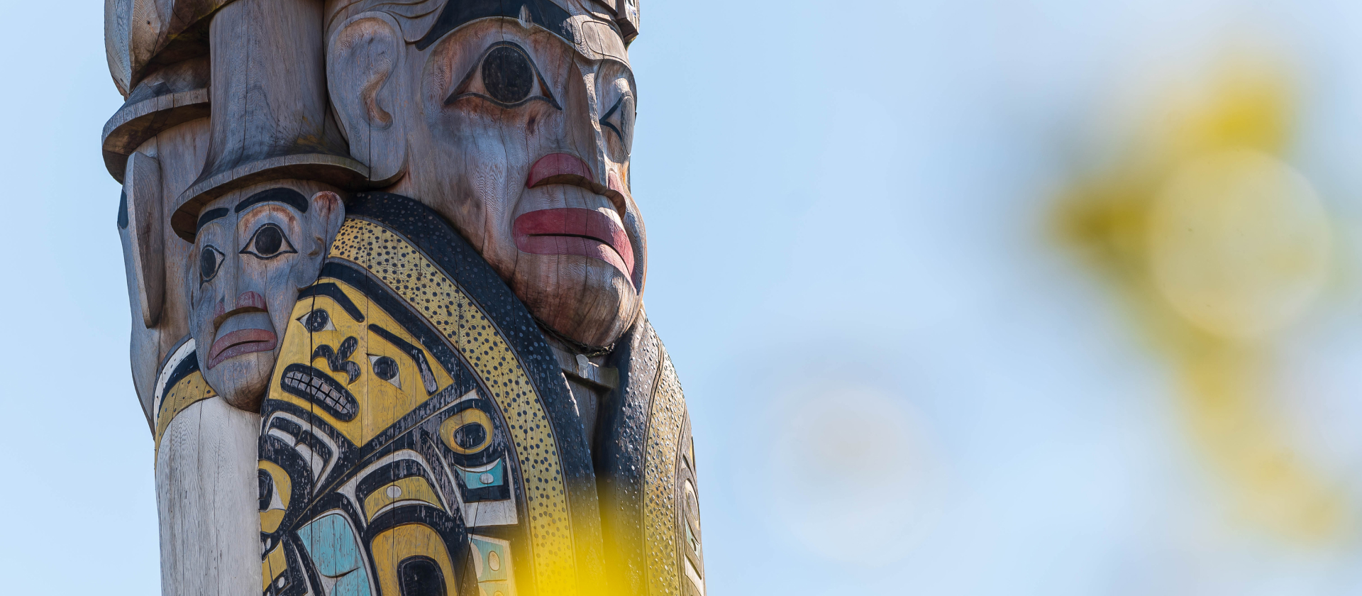 close-up shot of a carved face on the Reconciliation Pole at UBC's Vancouver campus